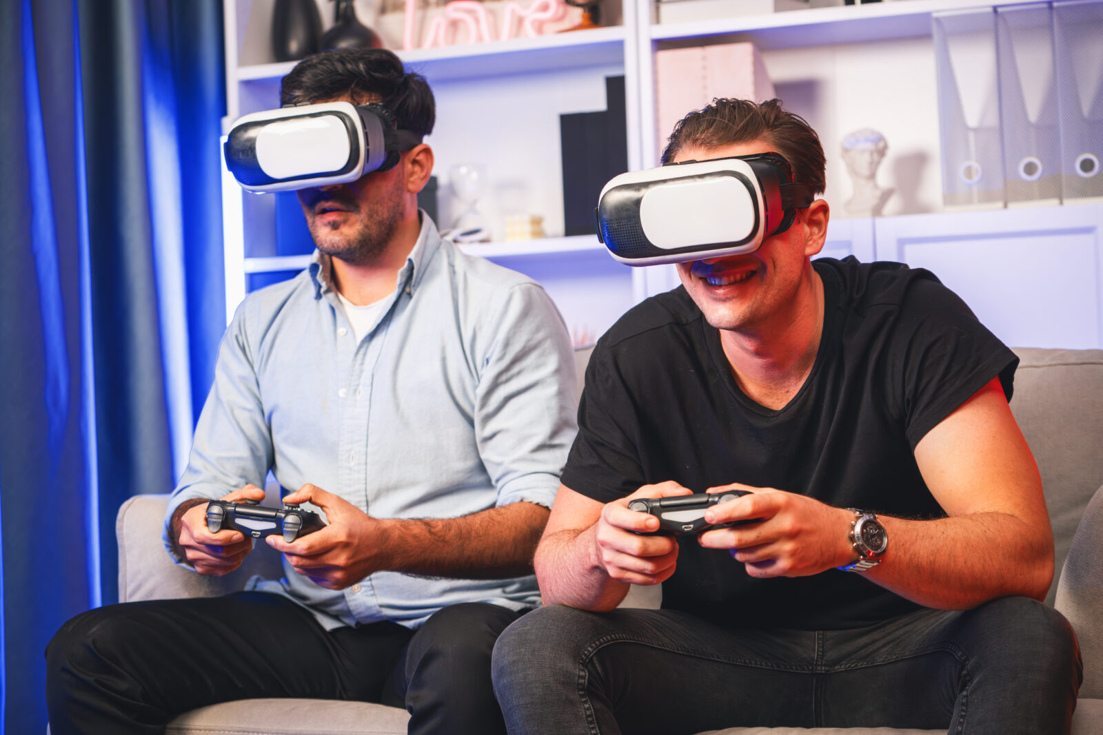 Home friend gamers playing video game using joysticks and vr headset. sellable.